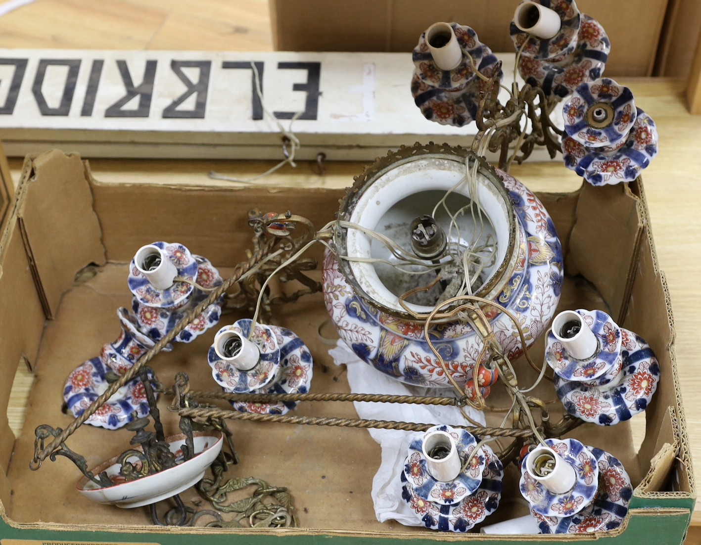 A 19th century spelter and Imari pattern porcelain three branch chandelier, converted to electric